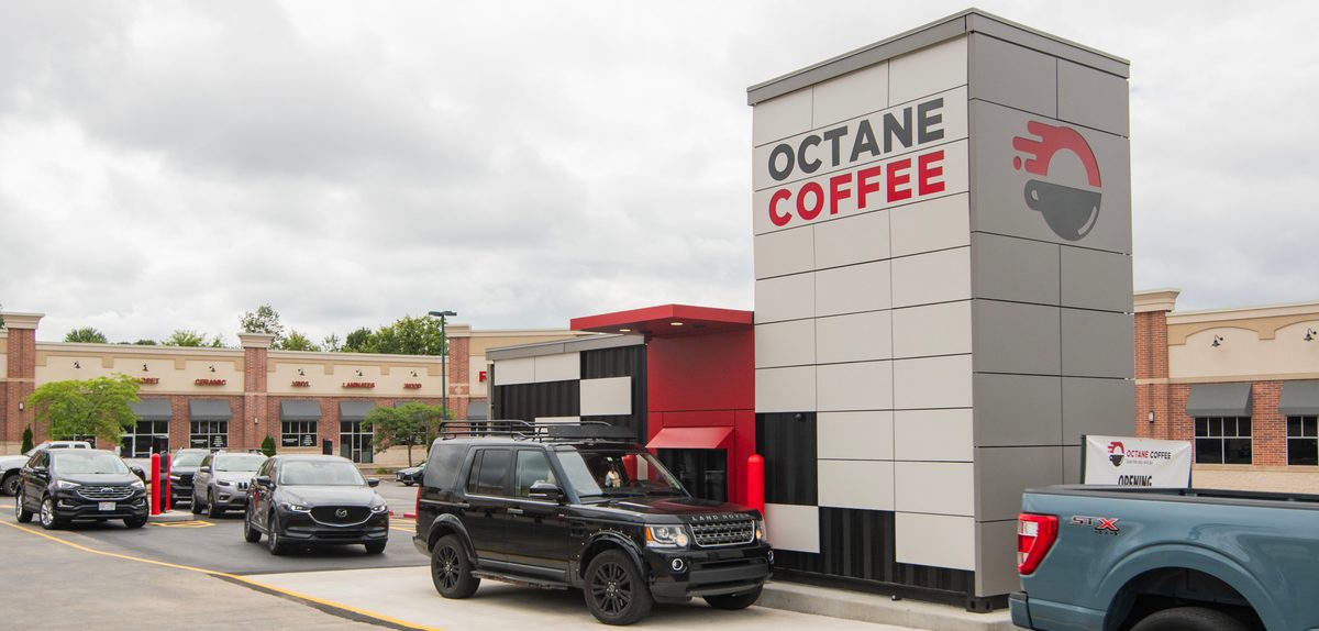 The Octane Coffee standalone drive-thru cafe on Bluemound Road with cars in both lanes